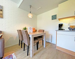 Dining area in Apartment Bos en Duin 31, Texel, ideal for cozy meals during your stay in the Wadden Islands.