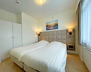 Bedroom with double bed in Apartment Bos en Duin 31, vacation home in De Dennen, Texel for a relaxing night's sleep.