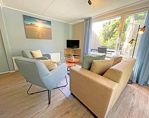 Bright living room in Apartment Bos en Duin 22, De Dennen, Texel with access to the terrace.