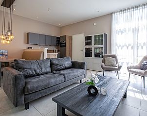 Interior of Bungalowpark Verste Coogh - Hermelijn, Texel with modern living room and lots of light.