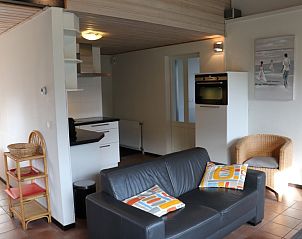 Comfortable living room in Holiday home Gortersmient 324, De Dennen, Texel with modern amenities and cozy atmosphere.