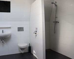 Modern bathroom with shower in Holiday home Gortersmient 324, De Dennen, Texel, offers luxury and comfort.