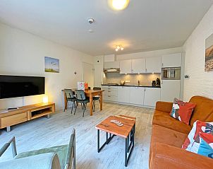 Bright living room of Apartment Bos en Duin 08, De Dennen, Texel, with access to nature.