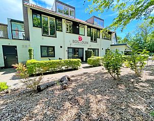 Entrance to Apartment Bos en Duin 08, De Dennen, Texel, with well-kept garden and sunny terrace.