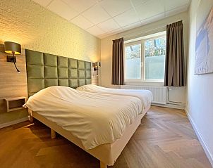 Comfortable bedroom in Apartment Bos en Duin 04, De Dennen, Texel with double bed and natural light.