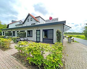 Exterior of Apartment Bos en Duin 04, De Dennen, Texel, surrounded by green nature and tranquility.