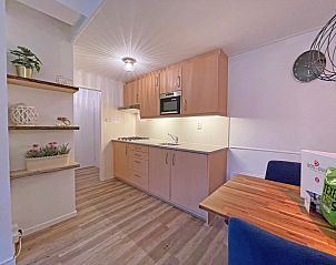 Comfortable double bedroom in Apartment Bos en Duin 27, De Dennen, Texel with a view of nature.