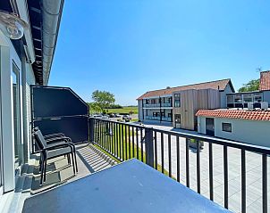 Exterior view of Apartment Bos en Duin 27, De Dennen, Texel located in a green and quiet area.