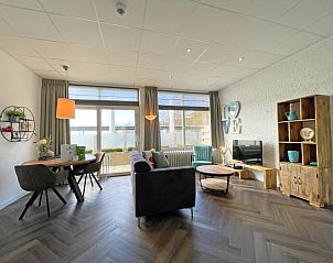 Apartment Bos en Duin 02 in De Dennen, Texel offers a spacious living room with modern interior and plenty of natural light.