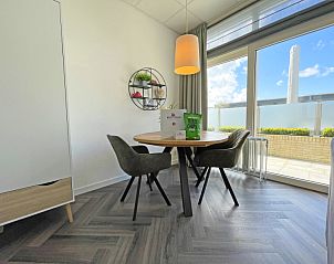 Dining area in Apartment Bos en Duin 02, Texel, overlooking the garden and space for cozy meals.