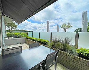 View from the terrace of Apartment Bos en Duin 02, Texel with green surroundings and fresh air.