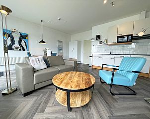 Offene Kche und Wohnzimmer im Apartment Bos en Duin 03, Texel, Watteninseln, mit moderner Ausstattung und gemtlicher Atmosphre.