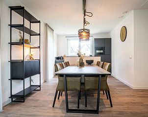 Dining area of Holiday Park De Koorn-aar Villa in De Dennen Texel with modern furnishings