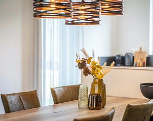 Cozy dining area in Holiday Park De Koorn-aar Villa on Texel