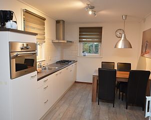 Modern kitchen in Holiday home the Pearl 214, De Dennen, Texel, with dining area and high-quality appliances.