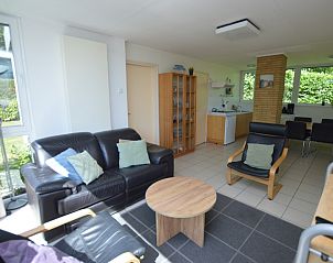 Vacation home de Parel 262 in De Dennen, Texel with spacious living room and dining area.