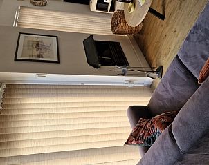 Knusse woonkamer met open haard in vakantiehuis Gortersmient 306, De Dennen, Texel, Bungalowpark Gortersmient.