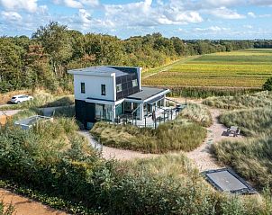 Aerial view of Strandvilla Hygge, a modern vacation home surrounded by nature in De Dennen, Texel, Wadden Islands.