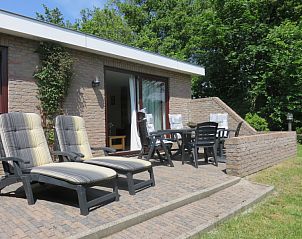 Spacious terrace at Bungalowpark Uterste Coogh, Bungalow 114 in De Dennen, Texel, ideal for relaxation.