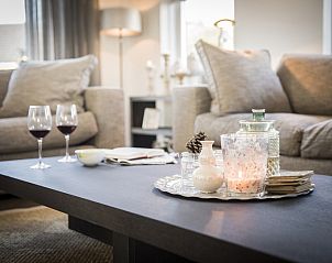 Atmospheric details in Villa by the Sea, Bungalowpark 't Hoogelandt, De Dennen, Texel with candles and wine glasses.