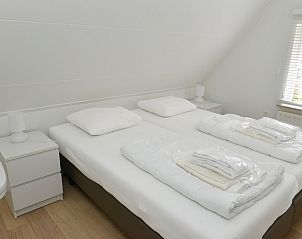 Gemtliches Schlafzimmer im Ferienhaus 't Wambas, De Dennen, Texel fr eine erholsame Nachtruhe.