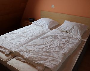 Tweepersoonsbed in Vakantiehuis Gortersmient 300, De Dennen, Texel. Comfortabel slapen op de Waddeneilanden.