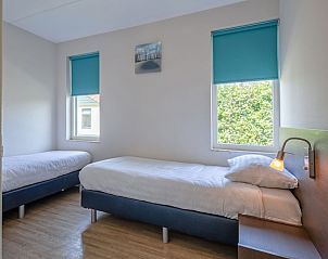 Double bedroom in Type 2 - 4 person vacation home in De Dennen, Texel, overlooking nature.