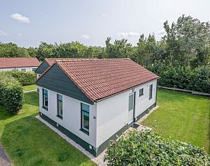 Aerial photo of Type 2 - 4 person vacation home in De Dennen, Texel, in the middle of green surroundings.