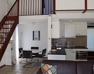 Spacious living room in Holiday Home Gortersmient 260, De Dennen, Texel with modern kitchen and dining area.