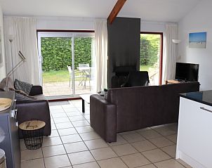 Cozy sitting area in Holiday Home Gortersmient 260, De Dennen, Texel overlooking green garden.