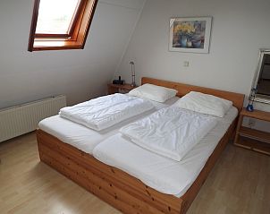 Comfortable bedroom in Holiday home Gortersmient 260, De Dennen, Texel with double bed and skylight.