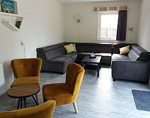 Gemtliches Wohnzimmer des Ferienhauses Ekster in De Dennen, Texel, ideal fr einen Familienurlaub auf den Watteninseln.