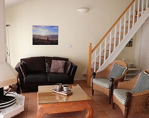 Knusse woonkamer met open haard in Vakantiehuis Gortersmient 264, De Dennen, Texel.