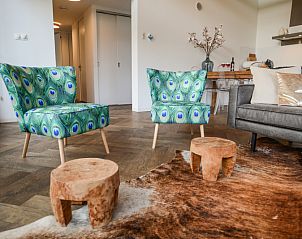 Cozy sitting area in Bungalowpark Oud Vredelust - Zeeskuum, Texel with colorful chairs