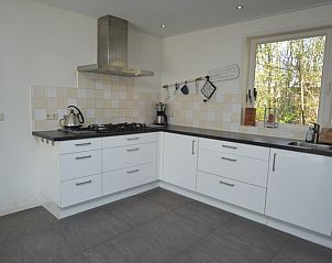Spacious kitchen in Holiday home the Pearl 190, De Dennen, Texel, equipped with modern appliances and plenty of work space.