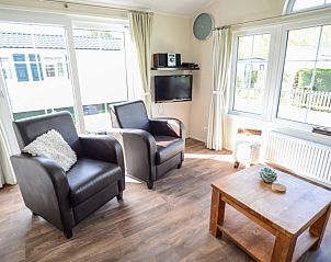 Bright living room with large windows in Holiday Park De Koorn-aar Type F, De Dennen, Texel.