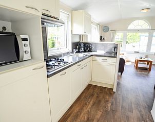 Fully equipped kitchen in Holiday Park De Koorn-aar Type F, Texel, with modern amenities.