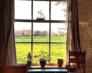 Uitzicht op groene velden vanuit Vakantiehuis in Formerum, Terschelling.