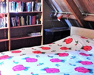 Buitenruimte met uitzicht op weiland bij Vakantiehuis in Formerum, Terschelling.