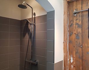 Stylish bathroom with shower in Holiday home in Formerum Terschelling.