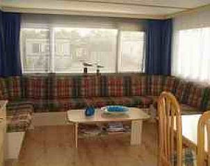 Cozy interior of Achaa mobile home in Formerum, Terschelling with spacious seating area on the Wadden Islands.