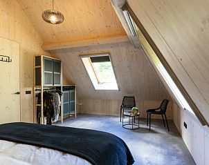 Zitgedeelte in zolderslaapkamer van Noordhoek vakantiehuis, Midsland Noord, Terschelling.