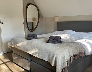 Comfortabele slaapkamer in Vakantiehuis Deugniet, Midsland Noord, Terschelling, voor een goede nachtrust.