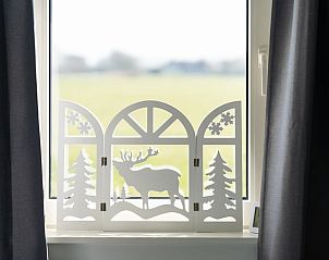 Decorative window with view in Holiday home in Ballum, Ameland.