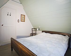 Sfeervolle slaapkamer in Beppe van Ameland vakantiehuis, Hollum, Ameland.