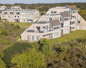 Architectonisch ontwerp van Zand appartementencomplex in Nes, Ameland, te midden van natuur.
