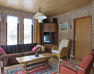 Comfortabele zithoek in Duinrust, Schiermonnikoog, perfect voor ontspanning na een dag in de natuur.