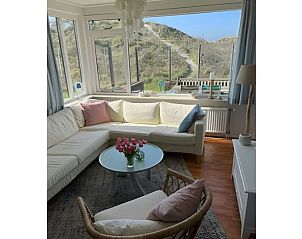 Gemtliches Wohnzimmer im Ferienhaus in Schiermonnikoog, einem Ferienhaus auf den Watteninseln mit Blick auf die Dnen.