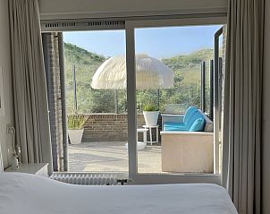 Blick aus dem Schlafzimmer des Ferienhauses in Schiermonnikoog, ein Ferienhaus auf den Watteninseln mit Terrasse.