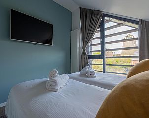 Guest house 451299 - Holiday property Noordzeekust - Zicht op de Molen